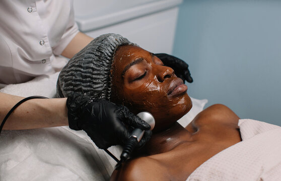 Apparat skincare procedure for afro-american woman