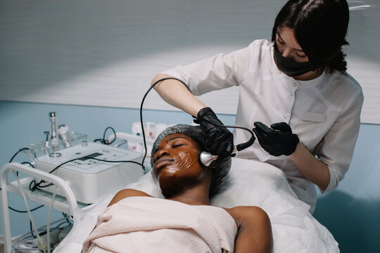 Apparat skincare procedure for afro-american woman