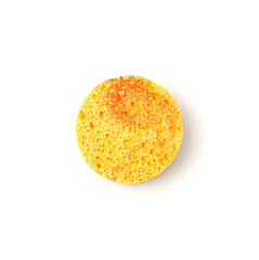 Yellow, round sponge for skin cleansing is isolated on a white background. Beauty, skin Care. Spa accessories. The concept of a healthy lifestyle.
