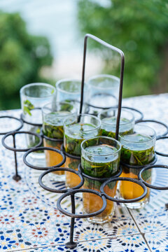 Moroccan tea in small cups in special stand
