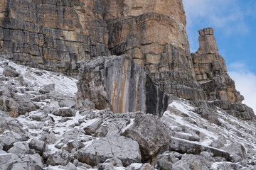 Fototapeta na wymiar Huge stone at the backside of the Tre Cime di Lavaredo, Italian Drei Zinnen, German in snow in october 2020