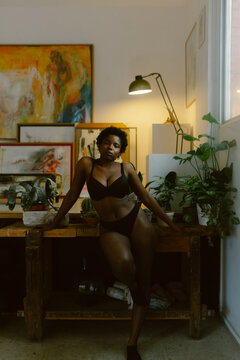 Beautiful afro plus-size woman in underwear.