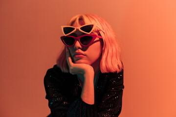 Young woman in orange light