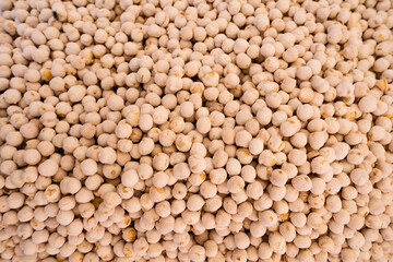 Dry organic chickpeas background. A bunch of chick peas seen from above.