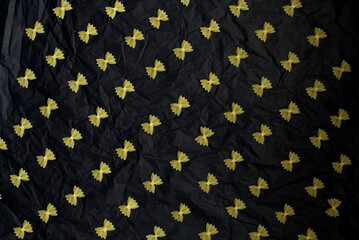farfalle pasta on a black background