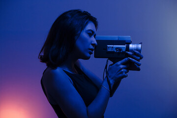 Woman filming with a Super 8mm camera