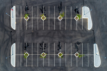 Aerial top down view of black asphalt car park