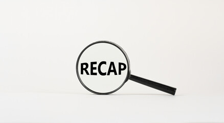 Magnifying glass with word recap on beautiful white background. Business concept, copy space.