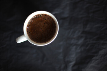 Cup of coffie on a black background