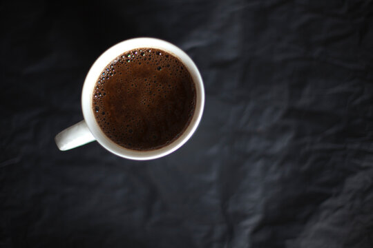 Cup of coffie on a black background
