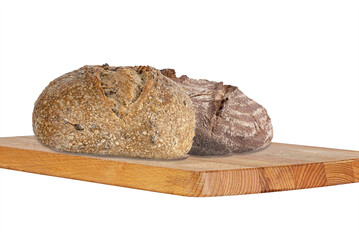 round wheat and rye bread with a cracked crust on a wooden tray