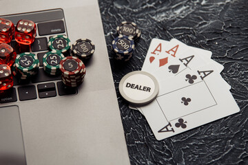 Chips, dices and playing cards for poker online or casino gambling. Online poker concept.