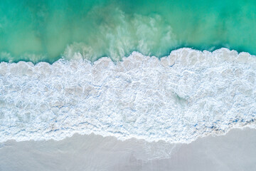 Aerial top down views of sandy beach in summer