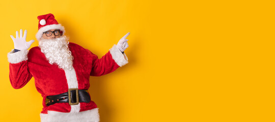 santa claus isolated on background pointing for ad or text