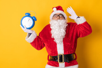 santa claus isolated on background with clock or alarm clock