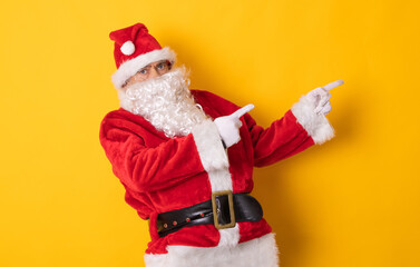 santa claus isolated on background pointing for ad or text