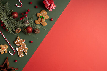 Christmas holiday layout made with gingerbread man, candy cane, ornaments and holly berries on dual...