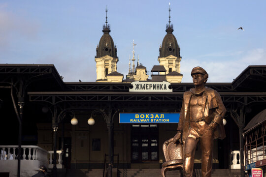 Zhmerinka, Ukraine - November 10, 2019. Monument to Ostap Bender - the hero from the book "12 Chairs" (Ilf and Petrov). Ostap Bender in the photo of the old railway station.
