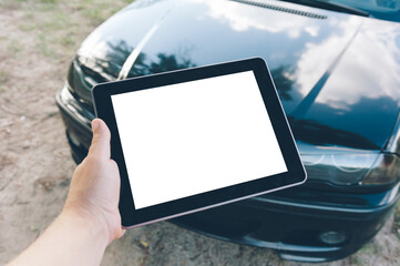 Close-up Tablet mockup. Against the background of a black car.