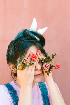 Anonymous rabbit woman with roses.