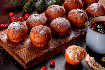 Beautiful delicious fresh cocoa muffins on the Christmas table