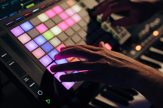 Man creating music with a drum pad
