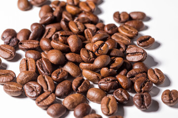 Heap of fresh roasted coffee beans isolated on white background as package design elements
