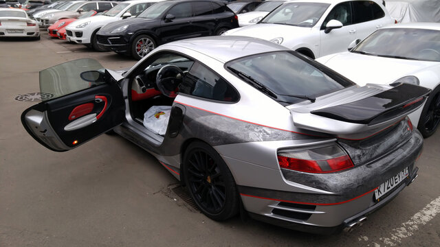 Moscow. Autumn 2018. Gray Porsche 911. Tuned by Mansory. With a wide body kit and vinylography and airbrushing. Exclusive tuning.