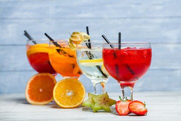 Cocktails and soft drinks. Fruit juice cocktail drink. assorted cocktail drinks. Different cold refreshing cocktails on wooden table