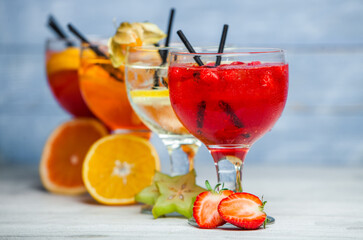 Cocktails and soft drinks. Fruit juice cocktail drink. assorted cocktail drinks. Different cold refreshing cocktails on wooden table