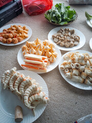 Prep various sukiyaki topping in white plate