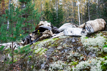 big amount of trash in forest, global environment issues