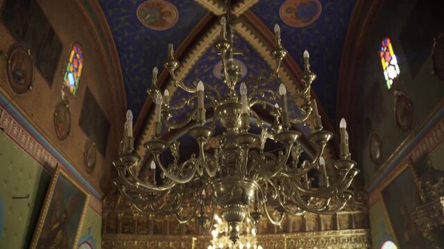 Symi, Greece - September 24, 2020: Interior with hanging Chandelier of Holy Monastery of Archangel Michael Panormitis located on an island in mediterranean sea.