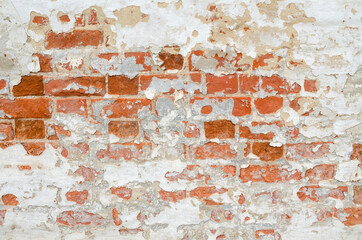 Red Old Weathered Brick Wall With Beaten Pieces Of Whitewash, Putty And Plaster