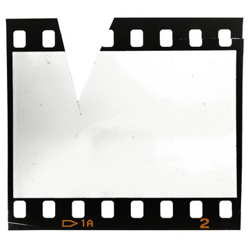 35mm film strip or frame on white with cut out missing piece on the top side.