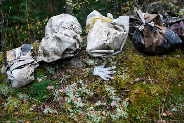 big amount of trash in forest, global environment issues
