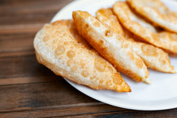 one portion ciborek in plate on wooden table