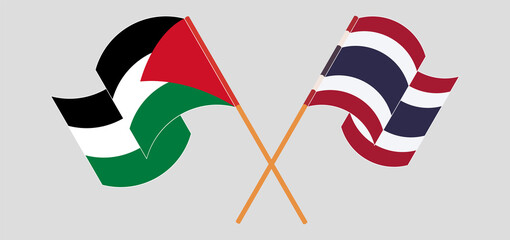 Crossed and waving flags of Palestine and Thailand
