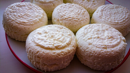 Delicate Circles Of Delicious Cow Cheese Curd Ready To Be Consumed.
