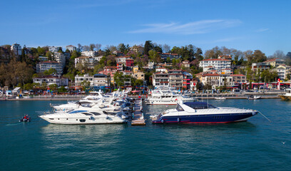 Fototapeta na wymiar Luxury yachts are parked in Istanbul before the apartments and highway.