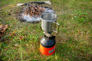 Cup on a portable gas camping stove in Markische Schweiz Buckow Brandenburg Germany