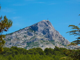 Magnificent landscape with the Sainte-Victoire mountain under a beautiful blue sky in Provence near...