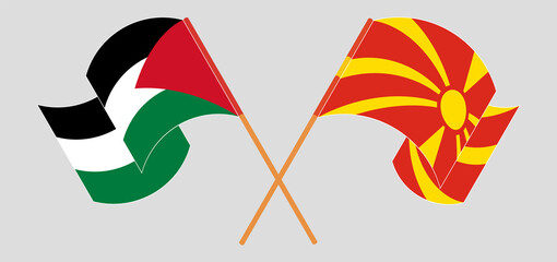Crossed and waving flags of Palestine and North Macedonia