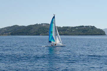 Evia island, Greece - June 28. 2020: Sailing boat on the move on the high seas 