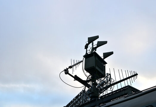 Radar for warning of the appearance of a target and the detection and location of objects. Military locator and antenna equipment vehicle. War or military concept on sunset background. Army exercises - Powered by Adobe