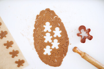 Making christmas gingerbread cookies. Cutting Christmas ginger cookies top view