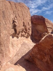 Fototapeta na wymiar Historical petroglyphs - Yerbas Buenas, Valle del Arcoiris - Rainbow Valley, San Pedro de Atacama, Chile. Beautiful and colorful mountains in the Atacama desert, one of the driest places in the world