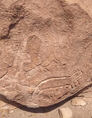 Historical petroglyphs - Yerbas Buenas, Valle del Arcoiris - Rainbow Valley, San Pedro de Atacama, Chile. Beautiful and colorful mountains in the Atacama desert, one of the driest places in the world