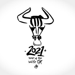 Year of the Ox in Chinese zodiac. Black ink brush calligraphy 2021 and horns. Vector element for New Year's design in flat style. Illustration of 2021 year of the Ox.

