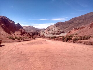 Fototapeta na wymiar Yerbas Buenas, Valle del Arcoiris - Rainbow Valley, San Pedro de Atacama, Chile. Beautiful and colorful mountains in the Atacama desert, one of the driest places in the world. 